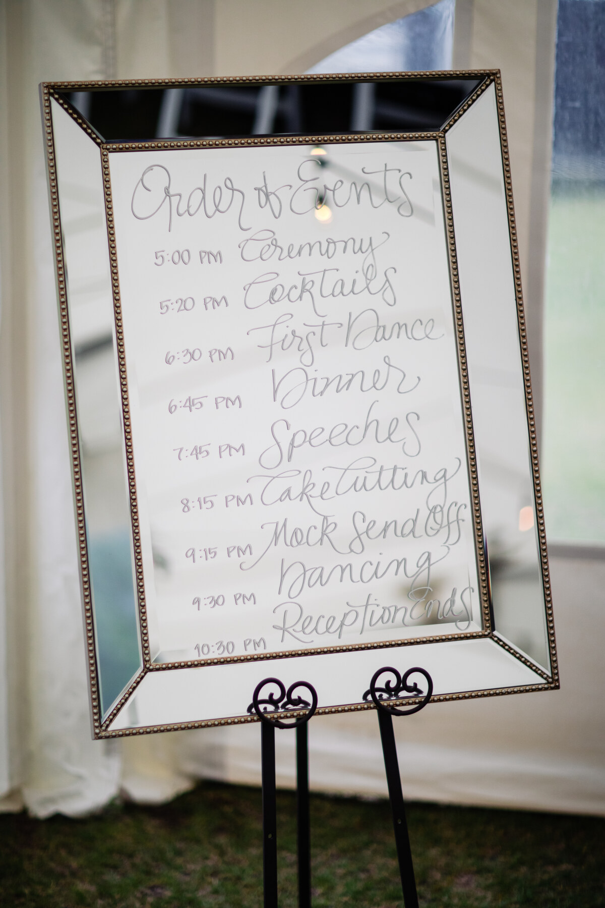 Order of Events on mirror at wedding reception.