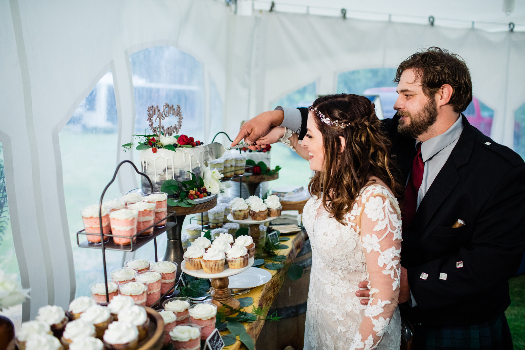 Bride and Groom cutting wedding cake.